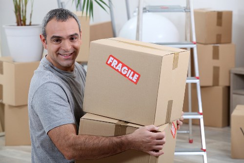 Moving truck near modern apartments and shared entrances in Wembley Park