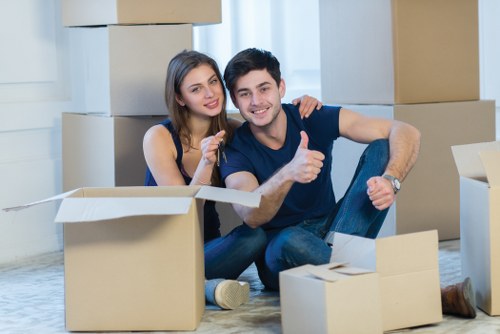 Mover wearing PPE while handling boxes safely
