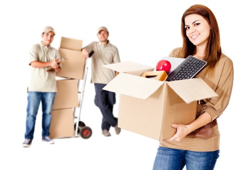 Movers handling furniture in a modern Wembley Park apartment building