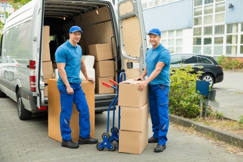 Removal workers loading a van near Wembley Park residential property