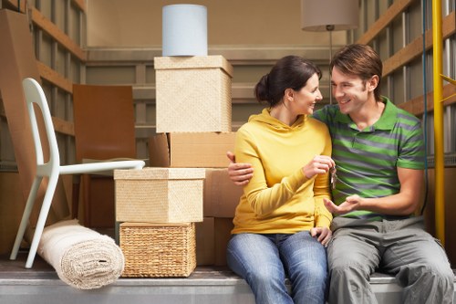 Professional movers handling packed boxes and furniture in Wembley Park